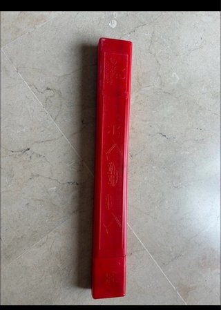 Triángulo de avería coche rojo