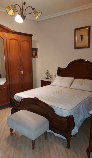 Dormitorio de matrimonio madera oscura