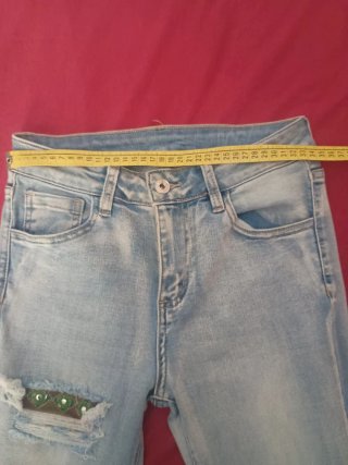 Jeans bambina con decorazioni fondo,taglia M ragaz