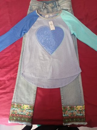 Jeans bambina con decorazioni fondo,taglia M ragaz