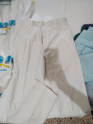 Traje chaqueta y pantalón beige a rayas