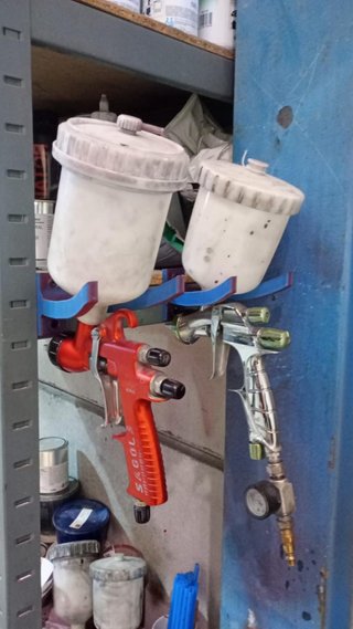 Soporte para pistolas de pintura