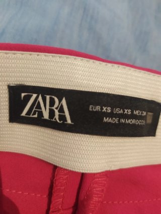 Pantaloni donna fucsia a zampa
