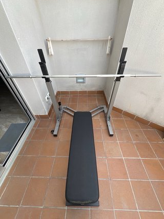 Rack plegable + banc + barra + discos .