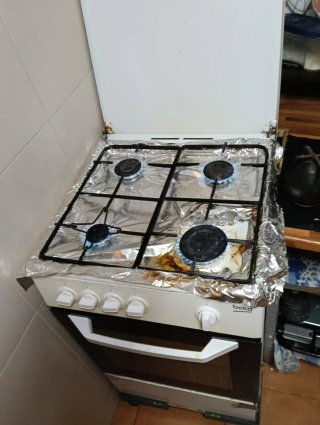 Cocina 4 fuegos gas butano y horno