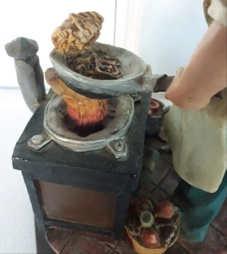 Statua cuoco con cucina e accessori