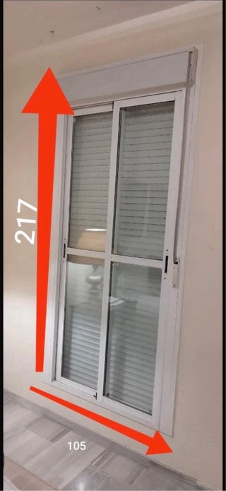 Ventana Climalit con persiana y Reja Maciza