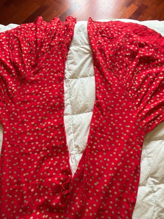 Pantaloni rossi a pallini dorati