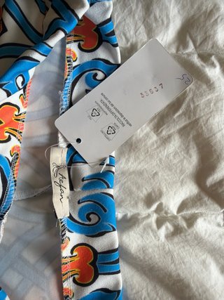 Pantaloni a zampa elasticizzati fantasia