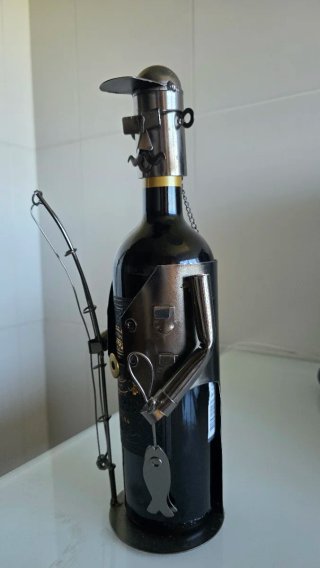 Escultura metálica pescador