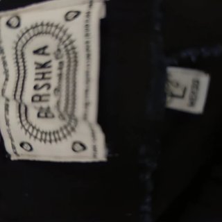 Pantalón negro elástico acampanado