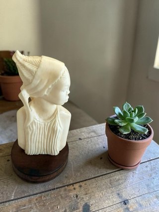 Talla de figura africana
