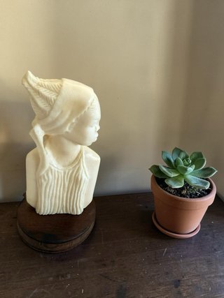 Talla de figura africana