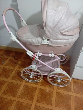 Carrito de muñecas rosa