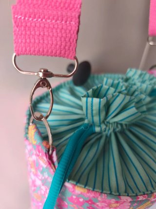 Bolso bombonera flores rosa y turquesa