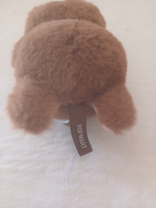 Peluche marrón con capucha y orejas
