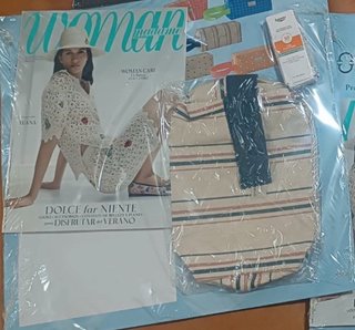 Neceser , crema Eucerin y revista