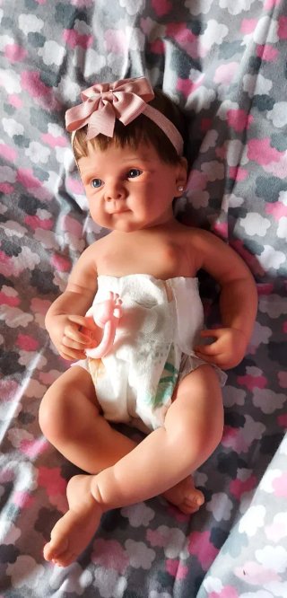 Preciosa bebé reborn silicona niña con pelito