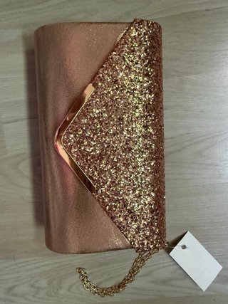 Bolso de fiesta dorado y rosa con purpurina