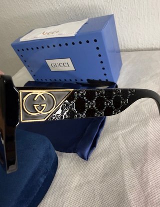Occhiali da sole Gucci neri e dorati