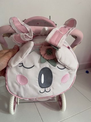 Cochecito de muñecas rosa con bolso