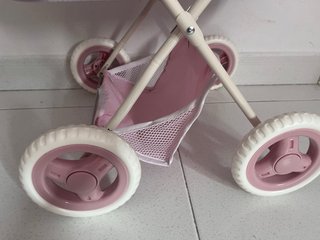 Cochecito de muñecas rosa con bolso