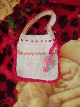 Bolso tejido a mano para bebé