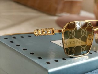 Occhiali da sole Gucci unisex oro Reflex fucsia