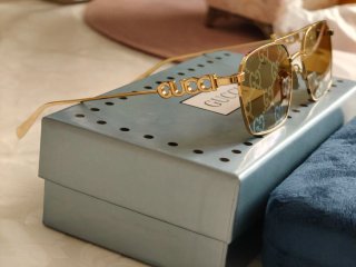Occhiali da sole Gucci unisex oro Reflex fucsia