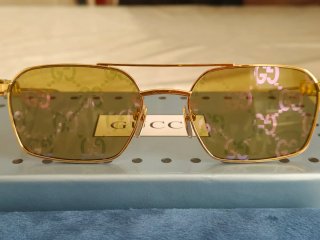 Occhiali da sole Gucci unisex oro Reflex fucsia