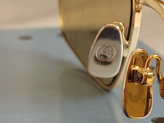 Occhiali da sole Gucci unisex oro Reflex fucsia
