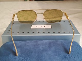 Occhiali da sole Gucci unisex oro Reflex fucsia