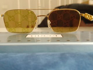 Occhiali da sole Gucci unisex oro Reflex fucsia