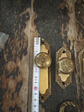 Antiguo conjunto de cortinero y tiradores