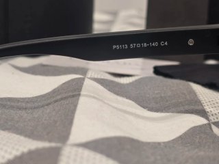 Occhiali da sole Prada neri con lenti blu
