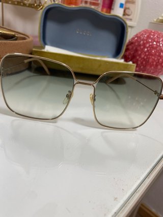 Occhiali da sole Gucci dorati e verdi