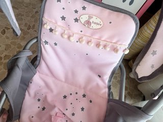Carrito de muñecas rosa con estrellas