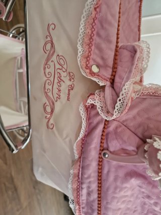 Cochecito bebé reborn rosa