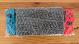 Nintendo Switch OLED (2 juegos de regalo) y caja