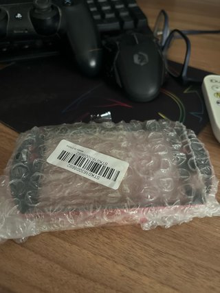 Funda metálica PSP Go roja sin usar