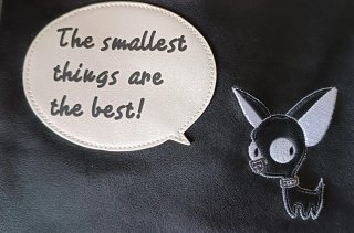 Bolso de mano con perro y frase