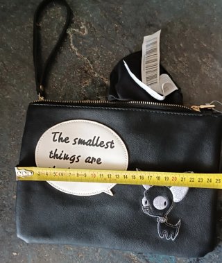 Bolso de mano con perro y frase