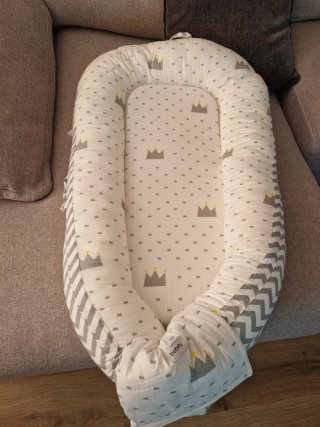 Minicuna rosa con colchón y cama nido