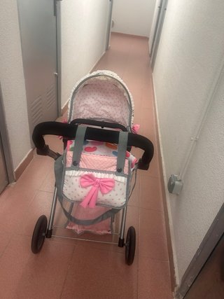 Carrito de juguete rosa con bolso
