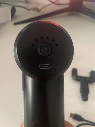 Pistola de masaje