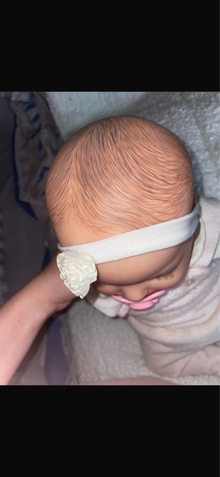 Muñeca realista bebé con chupete