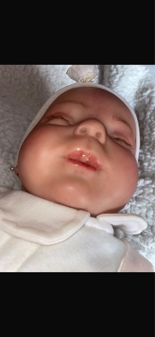 Muñeca realista bebé con chupete