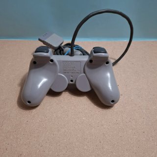 Playstation 1 con controller e giochi
