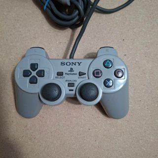 Playstation 1 con controller e giochi