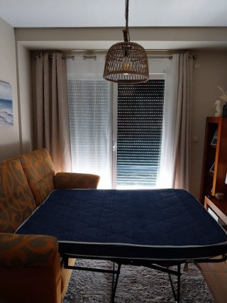 Sofá cama tela naranja y beige